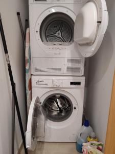 a washing machine and a dryer in a room at Blue bay Sliema in Sliema