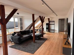 a living room with a couch and a table at hirsch APARTEMENTS in Rheine