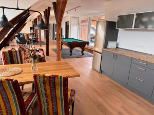 a kitchen and dining room with a pool table at hirsch APARTEMENTS in Rheine