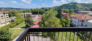 a balcony with a view of a town at Apartman Ograde in Bosanski Novi