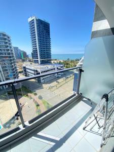 a view from the balcony of a building at Coastal Breeze Apartment in Batumi