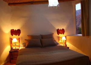 Una cama o camas en una habitación de Cabañas Azul Andino