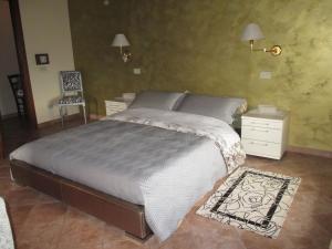 Postel nebo postele na pokoji v ubytování Country House La Fattoria Bellandi