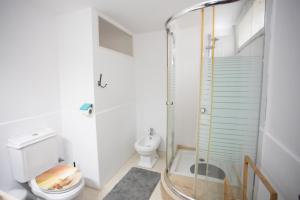 a bathroom with a shower and a toilet at Apartamento en Residencia Brooks Iberia in Tangier +16 photos