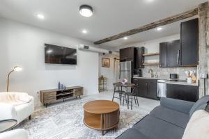 a living room with a couch and a table at Park Hotel 2BR Suite 306 in Chattanooga