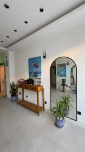 a room with a mirror and a table and plants at Taga Hotel in Bitez +92 photos