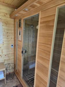 a door to a sauna in a cabin at Pájer Plázs & Resort in Gyomaendrőd +35 photos