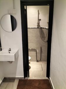 a bathroom with a sink and a toilet and a shower at 910 Entire Homestay Seremban Town, Templer, Lobak, Lekas Highway in Seremban