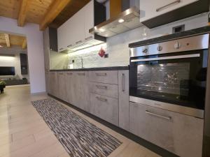 a large kitchen with a large oven in it at La dimora nelle Rue in Civitella Roveto