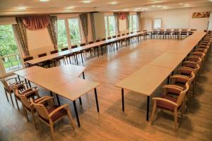 a large room with tables and chairs in it at Weststeirischer Hof in Bad Gams