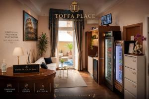 a toffee palace living room with a toffee place sign at Toffa Place In Rome in Rome