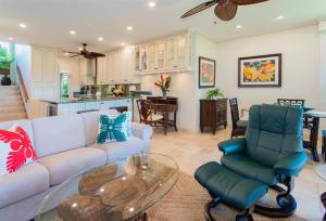 a living room with a couch and a table at 622 Kapalua Ridge Villa in Lahaina