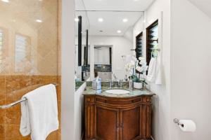 a bathroom with a sink and a mirror at 622 Kapalua Ridge Villa in Lahaina +32 photos