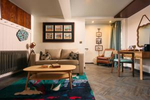 a living room with a couch and a table at Pedn-Olva in St Ives +45 photos