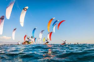 a group of people in the water with kites at FERRY HOUSE stranraer in Stranraer