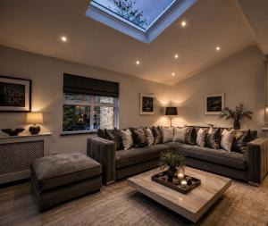 a living room with a large couch and a skylight at Chowdene Lodge Estate in Gateshead