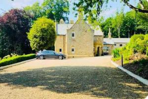 a house with a car parked in the driveway at Chowdene Lodge Estate in Gateshead +26 photos