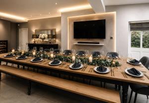 a long table with candles and greenery at Chowdene Lodge Estate in Gateshead