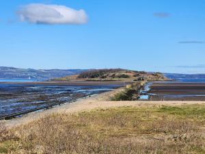 a view of a body of water with a cloud at Quay Cottage in Cramond