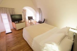 Ένα ή περισσότερα κρεβάτια σε δωμάτιο στο Dimora Intini