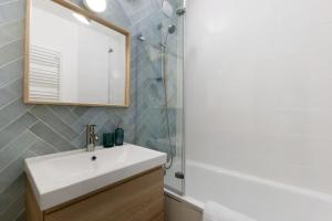 a bathroom with a sink and a mirror at Les Cimes - La Canopée in Gresse-en-Vercors +30 photos