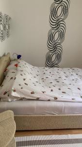a bed in a bedroom with a spiralling at Apartman Dream in Foča