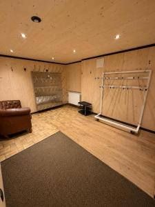 a large room with a couch and a stage at Demlhof, Gästehaus in Finkenberg