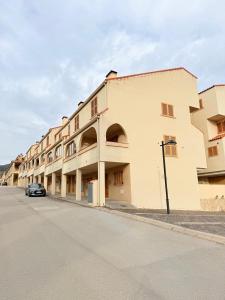 a building on the side of a street at Bungalow Esqui II Ref 076 in La Virgen de la Vega