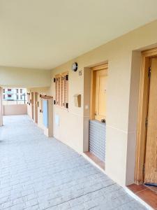 an empty hallway of a building with a hallway at Bungalow Esqui II Ref 076 in La Virgen de la Vega +34 photos