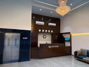 an office lobby with a reception desk and a waiting room at Hotel Skyboat Inn in Nashik