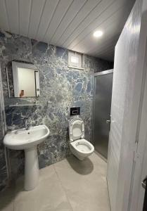 a bathroom with a toilet and a sink at Cnr in Manavgat