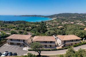 an aerial view of a villa with a lake at Casa Marina Cargèse in Cargèse
