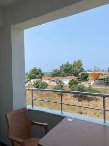 a balcony with a table and a view of a field at Cnr in Manavgat