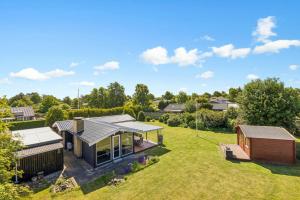 an aerial view of a house with a yard at Close To The Beach With Outdoor Spa in Slagelse