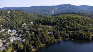 an aerial view of a lake and forest at Condos Kamik Tremblant by Manitonga in Mont-Tremblant