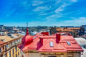 a view of a building with a red roof at Old Town Smârdan Apartment - Central Lively Area in Bucharest