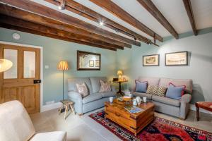 a living room with two couches and a coffee table at 3 Bed in Morpeth oc-75083 in Harbottle
