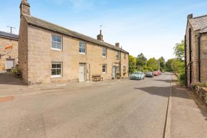 an empty street in front of a brick building at 3 Bed in Morpeth oc-75083 in Harbottle