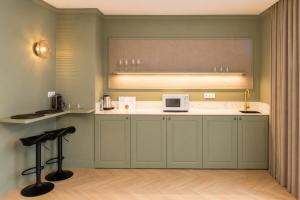 a kitchen with a counter with a microwave on it at AT Boutique Alma in Alicante