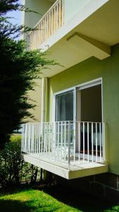 a balcony of a house with a porch and a window at City Centre Cozy Apartment in Porto