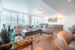 a living room with a couch and a table at Pepperclub Hotel in Cape Town