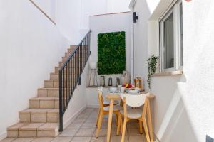 a small dining room with a table and chairs at Sunstay Arroyo House Velez in Vélez-Málaga