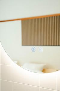a bathroom with a mirror and a sink at Maison Atago201 in Fukuoka