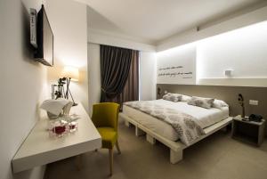 Postel nebo postele na pokoji v ubytování Malucri Resort + 27 fotografií