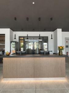 a lobby with a bar with couches at Hotel Ks in Bad Fallingbostel
