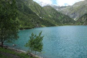 a lake in the middle of a mountain at Albergo Alpino Cheggio in Alpe Cheggio