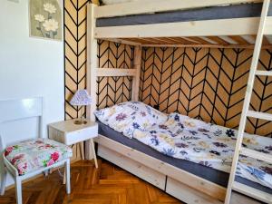 a bedroom with two bunk beds and a table at Ohrazenice 103 in Turnov