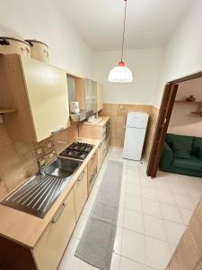 a kitchen with a sink and a stove at Da mare in Ginosa Marina