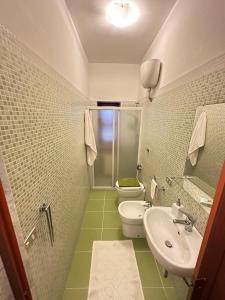 a bathroom with a toilet and a sink at Da mare in Ginosa Marina