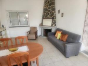 a living room with a table and a couch at House Proença in Ladoeiro +27 photos